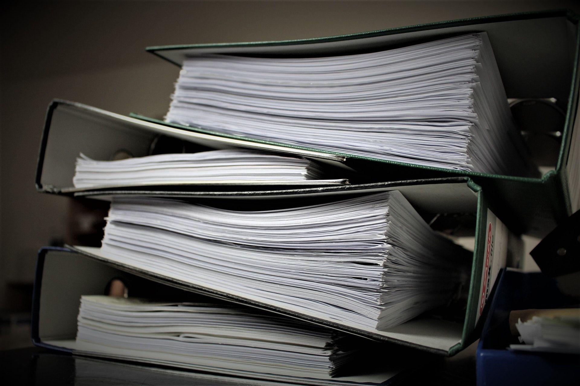 A stack of folders on a table.